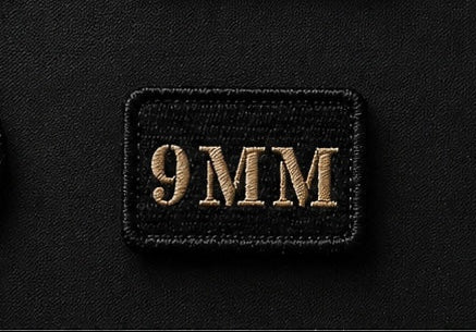 9MM patch on a black background