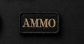 Black patch with 'AMMO' text on a black background
